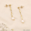 Boucles d'oreilles pendantes torsadées en acier et perles véritables 0323111 blanc