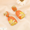 Boucles d'oreilles pendantes marguerite acier inoxydable émail 0324142 orange