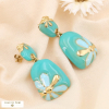 Boucles d'oreilles pendantes marguerite acier inoxydable émail 0324142 bleu turquoise