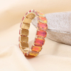 Bracelet élastique acier inoxydable strass colorées facettées 0223526 orange foncé