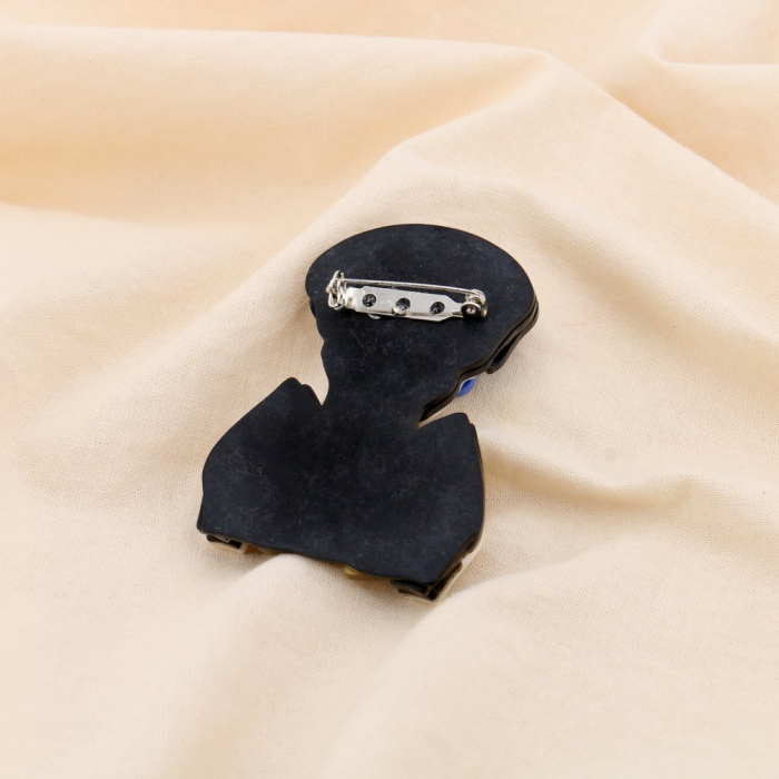 Broche Visage Féminin avec Nœud à Rayures en Résine et Métal blanc