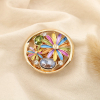 Broche aimantée ronde fleur filigrane métal strass émail 0524513 multi