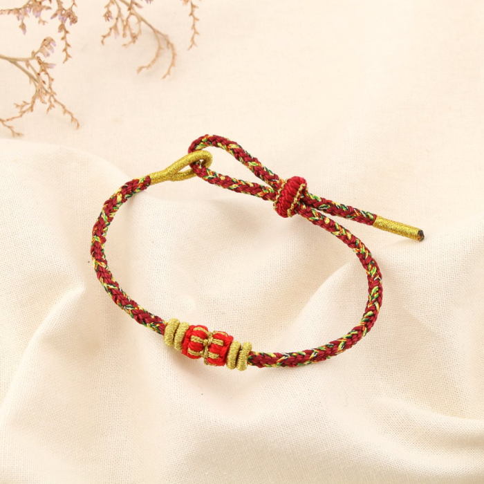 Bracelet ethnique tressé coulissant polyester 0225586 rouge bordeaux