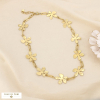 Collier fleurs stylisées chaîne trombone acier inox. 0126020 doré