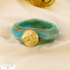 Manchette ouvrable résine médaillon martelé acier 0226008 bleu turquoise
