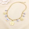Collier fleurs martelées acier perles porcelaine 0126145 doré