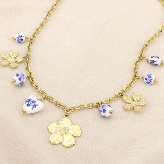 Collier fleurs martelées acier perles porcelaine 0126145 doré