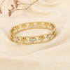 Bracelet jonc ginkgo acier inoxydable ajouré nacre 0226089 doré