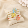Ensemble 5 bracelets marguerite acier émail perle 0226218 multi