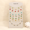 Ensemble 10 colliers acier cristal perle fleur 0125611 multi2