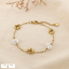 Bracelet fleur acier inox ajouré perle acrylique 0226173 doré