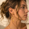 Boucles d’oreille pendantes acier feuilles martelées 0326030