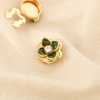 2 Cache-boutons fleur métal strass 0626506 vert