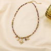 Collier acier pierres strass breloques célestes 0126576 marron